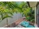 Back patio area with privacy fence and lush landscaping at 1288 Powderpuff Dr # 1202, Dunedin, FL 34698