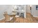 Bright kitchen with white cabinets, modern appliances, breakfast bar seating and sleek countertops at 1288 Powderpuff Dr # 1202, Dunedin, FL 34698