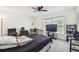 Bedroom with a ceiling fan, blinds, and a TV on a stand at 13003 Titleist Dr, Hudson, FL 34669