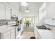 Clean kitchen featuring modern appliances and a breakfast bar at 13003 Titleist Dr, Hudson, FL 34669