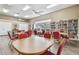 Bright library featuring tables, chairs, and extensive bookshelves at 13003 Titleist Dr, Hudson, FL 34669
