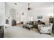 Spacious living room with a decorative fireplace and lots of natural light at 13003 Titleist Dr, Hudson, FL 34669