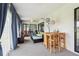 Well-lit sunroom with a bar and access to the backyard at 13003 Titleist Dr, Hudson, FL 34669
