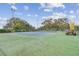 Enjoy the outdoor tennis court for an active lifestyle with lush landscaping and well maintained play area at 13003 Titleist Dr, Hudson, FL 34669