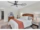 Cozy bedroom features a wicker headboard, ceiling fan and natural light at 1313 Markley Dr, Largo, FL 33770