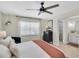 Bright bedroom featuring ensuite bathroom, ceiling fan, and natural light at 1313 Markley Dr, Largo, FL 33770