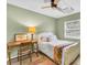 Bedroom with desk area, ceiling fan, and natural light at 1313 Markley Dr, Largo, FL 33770