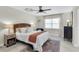 Comfortable bedroom features a ceiling fan, a window, and a stylish area rug at 1313 Markley Dr, Largo, FL 33770