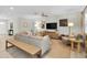 Bright living room with a comfortable seating arrangement, a modern TV setup, and ample natural light at 1313 Markley Dr, Largo, FL 33770