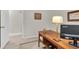 Office area features desk, lamp and monitor with natural light at 1313 Markley Dr, Largo, FL 33770