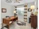 Office space with large desk, ceiling fan, and a window for natural light at 1313 Markley Dr, Largo, FL 33770