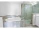 Bathroom featuring a bathtub, walk-in shower and vanity with white countertops at 1325 Snell Isle Ne Blvd # 505, St Petersburg, FL 33704