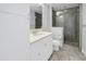 Bathroom featuring a vanity with a white countertop, storage and a glass enclosed shower at 1325 Snell Isle Ne Blvd # 505, St Petersburg, FL 33704