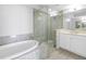 Bathroom featuring a bathtub, walk-in shower and vanity with white countertops at 1325 Snell Isle Ne Blvd # 505, St Petersburg, FL 33704