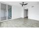 Bedroom featuring tile floors, a ceiling fan and access to a sliding glass door to a balcony at 1325 Snell Isle Ne Blvd # 505, St Petersburg, FL 33704