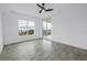 Bedroom featuring tile floors, a ceiling fan and a sliding glass door to a balcony at 1325 Snell Isle Ne Blvd # 505, St Petersburg, FL 33704