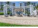 Community fire pit area with seating, surrounded by lush landscaping and elegant architecture at 1325 Snell Isle Ne Blvd # 505, St Petersburg, FL 33704
