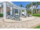 Relaxing fire pit area with comfortable seating and a pergola offering shade on sunny days at 1325 Snell Isle Ne Blvd # 505, St Petersburg, FL 33704