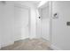 Hallway area featuring a white door, an elevator and exit stairs signage for fire safety at 1325 Snell Isle Ne Blvd # 505, St Petersburg, FL 33704