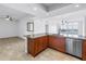 Open kitchen with granite countertops, stainless steel appliances, and water view at 1325 Snell Isle Ne Blvd # 505, St Petersburg, FL 33704