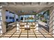 Covered outdoor kitchen with a built-in sink and countertop space, perfect for entertaining poolside at 1325 Snell Isle Ne Blvd # 505, St Petersburg, FL 33704