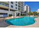 Resort-style pool area offers plenty of space for relaxation, surrounded by lush landscaping and modern architecture at 1325 Snell Isle Ne Blvd # 505, St Petersburg, FL 33704