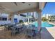 Enjoy poolside dining under a covered area, complete with comfortable seating and stunning views of the pool and grounds at 1325 Snell Isle Ne Blvd # 505, St Petersburg, FL 33704
