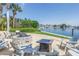Picturesque waterfront fire pit area with serene views of the bay and lush greenery at 1325 Snell Isle Ne Blvd # 505, St Petersburg, FL 33704