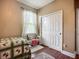 Relaxing bedroom features hardwood floors, closet, window and an area rug at 13608 Artesa Bell Dr, Riverview, FL 33579