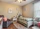 Relaxing bedroom boasts a ceiling fan, chair and accent wall at 13608 Artesa Bell Dr, Riverview, FL 33579