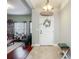 Bright foyer with tile flooring, stylish decor, and a view into the living area at 13608 Artesa Bell Dr, Riverview, FL 33579