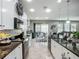 Well-appointed kitchen with granite counters, white cabinets and stainless steel appliances at 13608 Artesa Bell Dr, Riverview, FL 33579