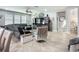 Inviting living room features a sectional sofa, media center and neutral tile flooring at 13608 Artesa Bell Dr, Riverview, FL 33579