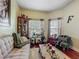 Cozy living room with hardwood floors, comfortable seating, and decorative accents at 13608 Artesa Bell Dr, Riverview, FL 33579