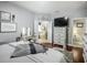 Main bedroom with wood floors, sitting area, wall decor, and an opening to the main bathroom at 13608 Artesa Bell Dr, Riverview, FL 33579