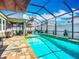 Inviting screened-in pool area with an in-ground pool, outdoor seating, and a relaxing atmosphere at 13608 Artesa Bell Dr, Riverview, FL 33579