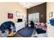 Bedroom featuring a white ceiling fan and a built-in desk in front of the window at 14042 Marlberry Way, Odessa, FL 33556