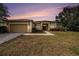 Charming single-story home featuring a two-car garage and well manicured landscaping at 14042 Marlberry Way, Odessa, FL 33556
