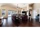Spacious living room features vaulted ceiling, wood floors, fireplace, and sliding door access to the pool at 14042 Marlberry Way, Odessa, FL 33556