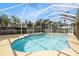 Backyard screened-in pool with clear water and a spacious pool deck at 14042 Marlberry Way, Odessa, FL 33556