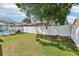 Backyard featuring well-maintained lawn and white vinyl fence surrounding the property at 1421 Buckner Rd, Valrico, FL 33596