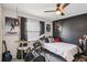Music themed bedroom featuring a bed, instruments, and bold wall art at 1421 Buckner Rd, Valrico, FL 33596