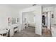 Mirrored closet doors reflect this bedroom with a vanity and white furniture at 1421 Buckner Rd, Valrico, FL 33596