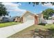 Exterior view of a single-Gathering home with a brick accent facade and a spacious driveway at 1421 Buckner Rd, Valrico, FL 33596