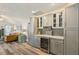 Custom bar area with wine storage, attractive tile backsplash and wood flooring at 1421 Buckner Rd, Valrico, FL 33596