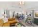 Bright living room with an open floor plan, breakfast bar, access to outdoor patio, and stylish decor at 1421 Buckner Rd, Valrico, FL 33596