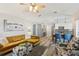 Bright living room with an open floor plan, breakfast bar, access to outdoor patio, and stylish decor at 1421 Buckner Rd, Valrico, FL 33596