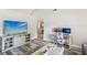 Living room view to kitchen featuring mounted television and entertainment center at 1421 Buckner Rd, Valrico, FL 33596
