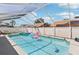 Sparkling screened-in pool area with a hot tub, lounge chair, and privacy fence at 1421 Buckner Rd, Valrico, FL 33596