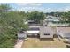 Overhead view of the charming yellow single-story home with solar panels at 1450 Seabreeze St, Clearwater, FL 33756